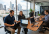 Fothion technicians monitor cloud computing systems and cyber threat protection interfaces from their laptops to assist a Los Angeles hybrid business.