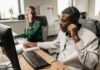 Fothion employees provide reliable IT support and services to a customer while working on their laptops.”