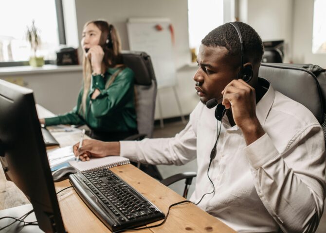 Fothion employees provide reliable IT support and services to a customer while working on their laptops.”