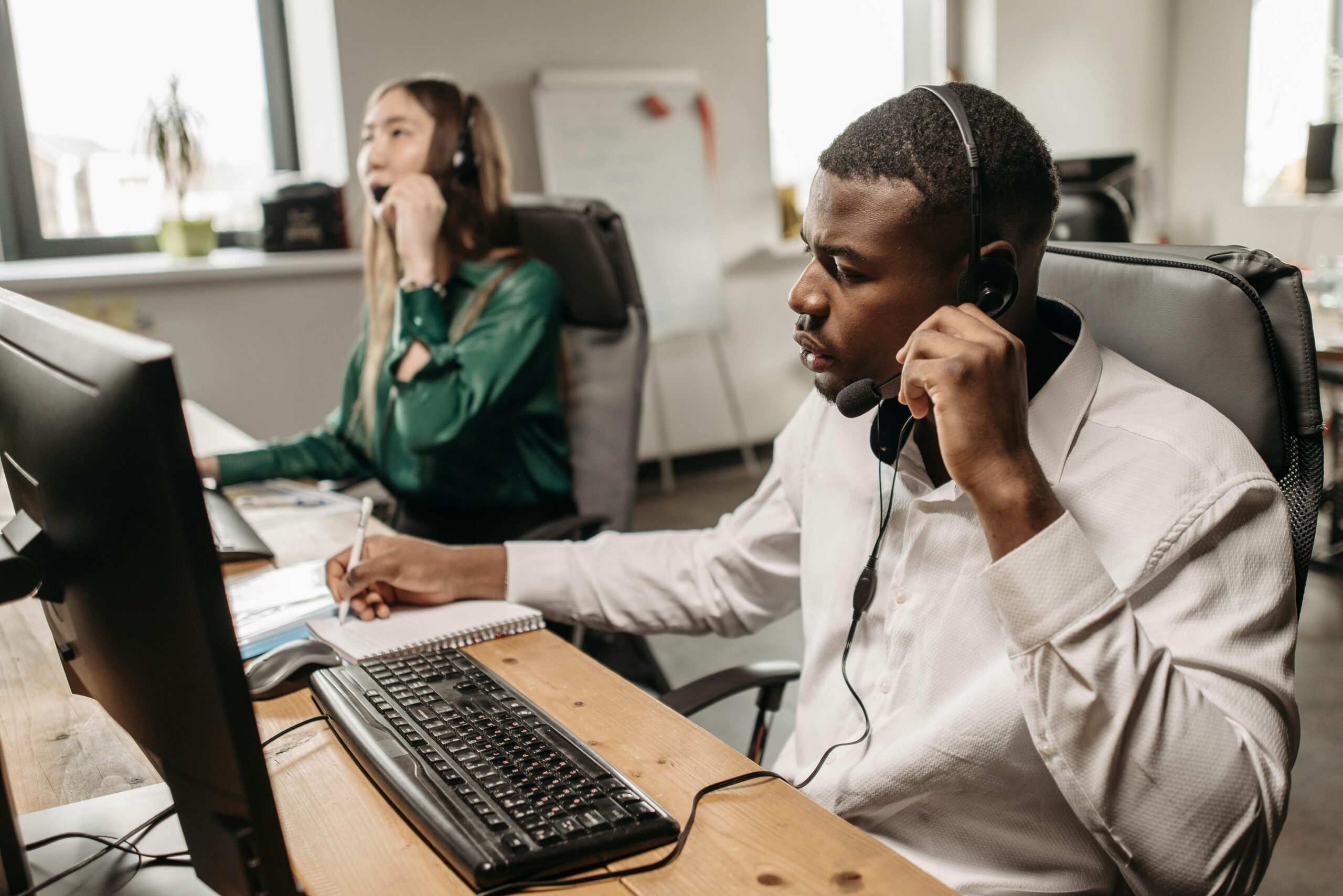 Fothion employees provide reliable IT support and services to a customer while working on their laptops.”